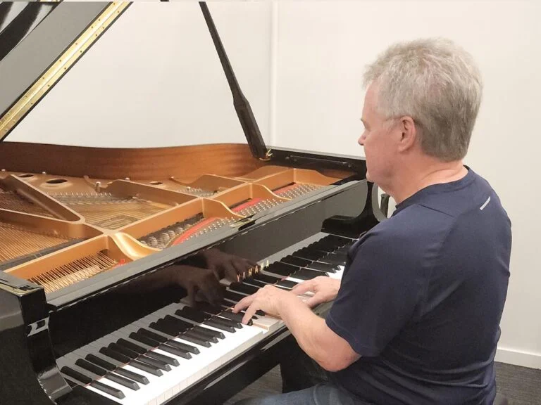 Bob Perry playing piano - Prestige Piano Services